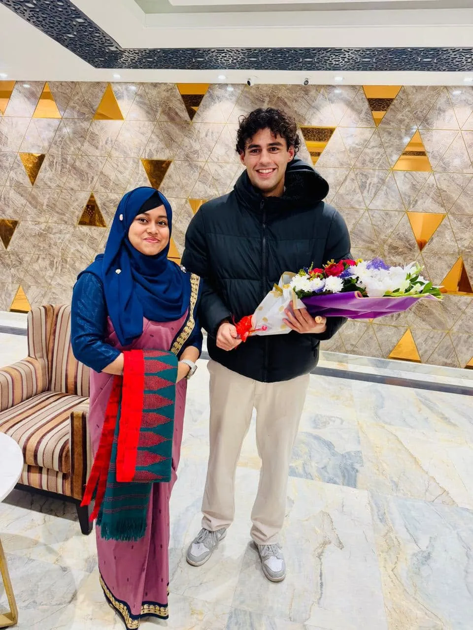 Las Sabir of PowerMatch greeting Rahana Islam with flowers during his visit to Dhaka