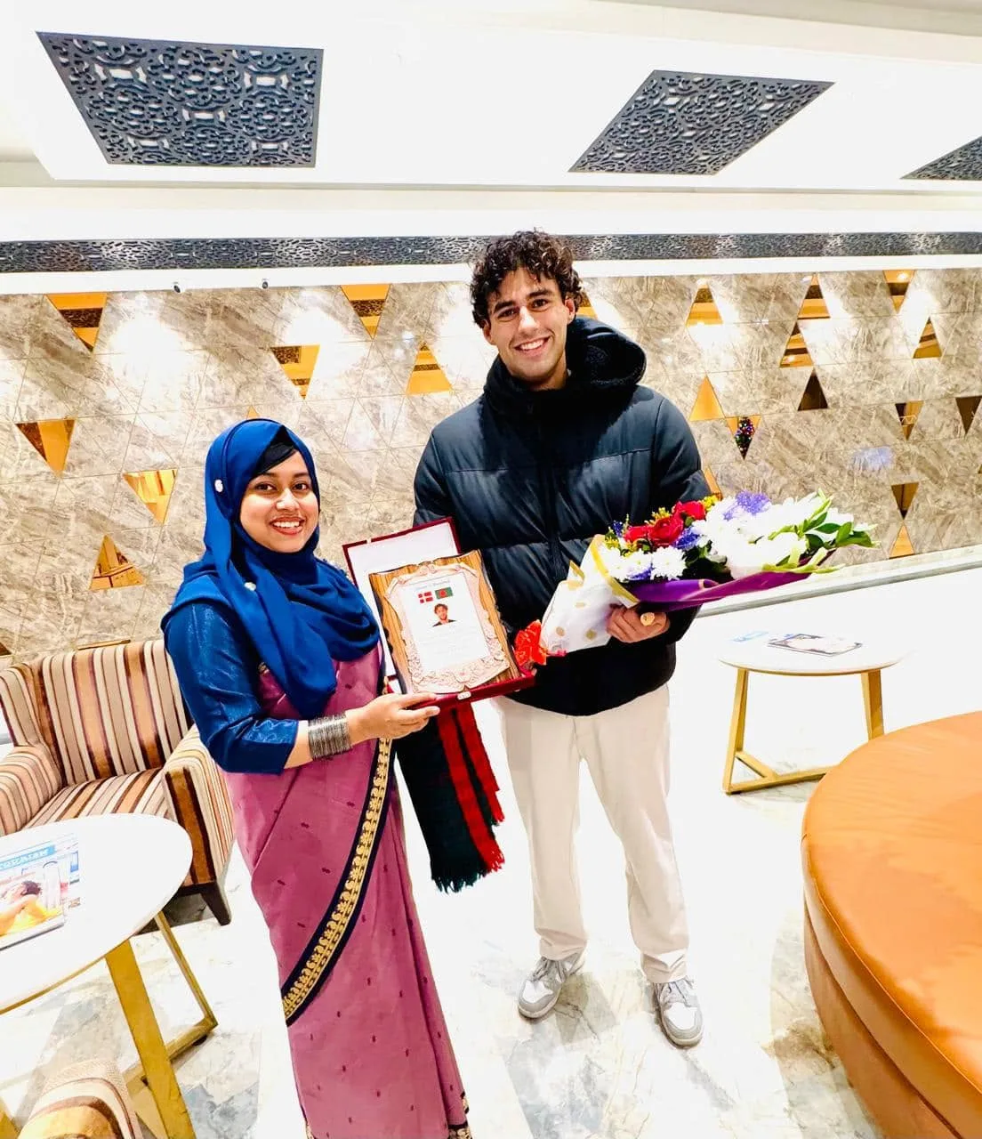 Rahana Islam and PowerMatch CEO Las Sabir with a Denmark and Bangladesh gift, Dhaka